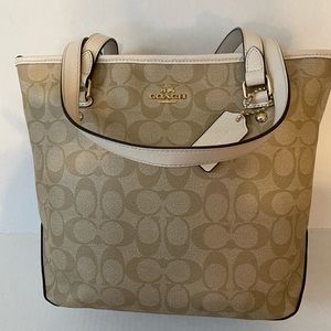 Tan Coach handbag with gold hardware